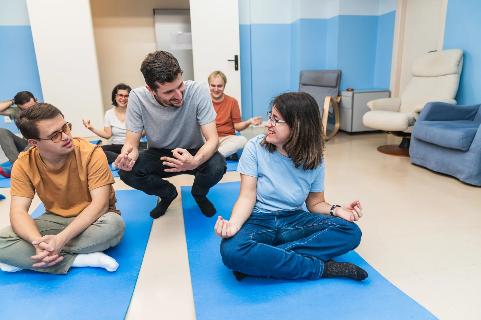 A small therapy group sharing space inside the clinic